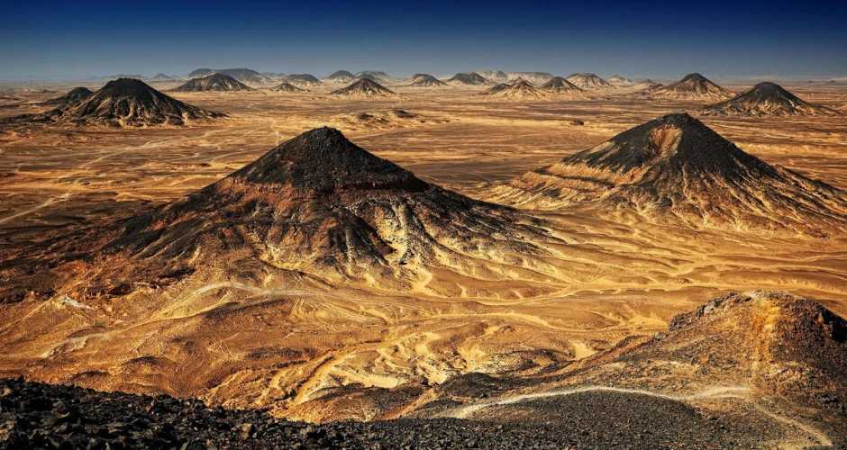 The Black Desert is a place where time slows down and nature tells its ancient story in shades of black and gold.